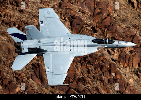 United States Navy Boeing F/A-18E Super Hornet (NG-263) of the VFA-14 Tophatters squadron from Naval Air Station Lemoore, flies low level through the Jedi Transition, Star Wars Canyon, Death Valley National Park, California, United States of America Stock Photo