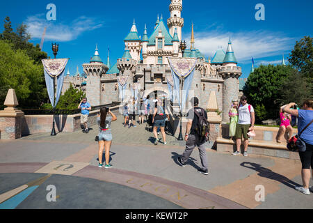 ANAHEIM, CA - OCTOBER 16, 2017: Guests walk through the landmark castle at Disneyland Theme Park Resort in California. Stock Photo