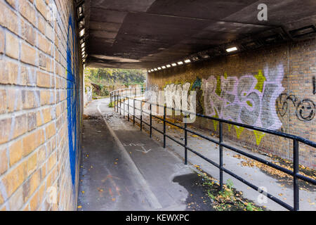 suburban pedestrian underpass, creepy, graffiti,grungy, Stock Photo