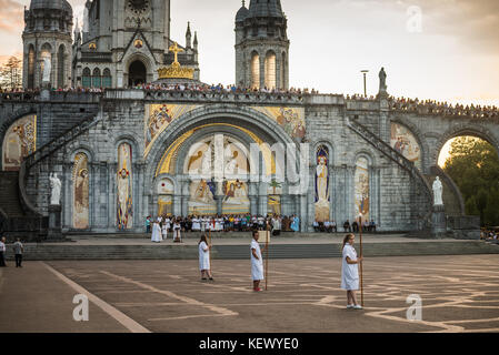 Pilgrims procession to Mass, Lourdes, Pyrenees, France, Europe. Stock Photo