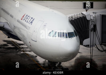 Boston Massachusetts New England North America USA , Logan International Airport  a Delta airplane stands at the gate Terminal E Stock Photo