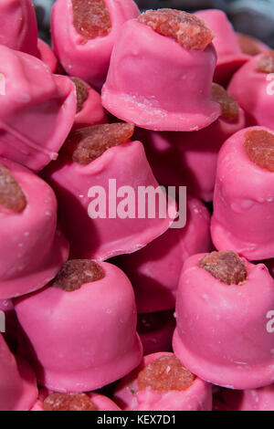 Delicious chunks of homemade strawberry sweets on display in Edinburgh during christmas market Stock Photo