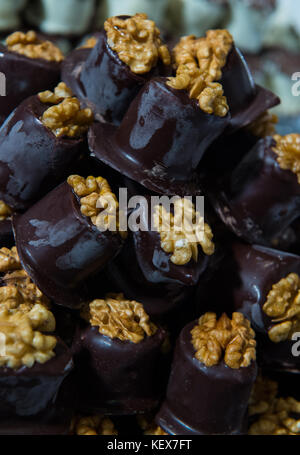 Delicious homemade dark chocolate walnut sweets, confectionery, on display in Edinburgh during christmas market Stock Photo