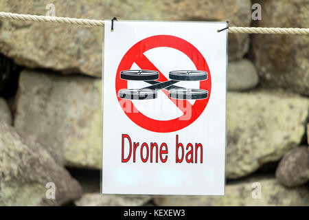 The sign with drone ban hangs on the rope. Zone with Prohibition of Drone. Stock Photo