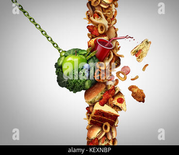 Nutrition detox concept diet breaking through as a break the habit symbol with awrecking ball demolishing a wall of junk food or fastfood. Stock Photo