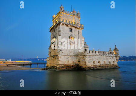 Torre de Belém (Belém Tower), a UNESCO World Heritage Site built in the 16th century in Portuguese Manueline Style at twilight. The River Tagus in the Stock Photo