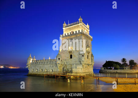 Torre de Belém (Belém Tower), a UNESCO World Heritage Site built in the 16th century in Portuguese Manueline Style at twilight. The River Tagus in the Stock Photo