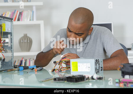 engineer repairs computers hard drive Stock Photo