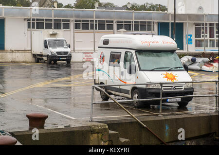 Camper van with people inside on Schull Pier, Schull, Ireland. Stock Photo