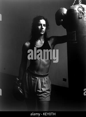 Woman/Girl in boxing gym after workout Stock Photo