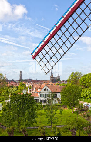 View over Bruges, Belgium, wing of historic windmill in foreground Stock Photo