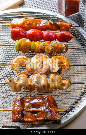 Seafood barbecue on grill Stock Photo