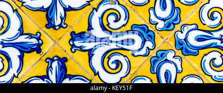 Colorful Vintage Style Ceramic Tile Pattern Texture and Background. Yellow, Blue and White Tiles for Floors and Walls. Stock Photo