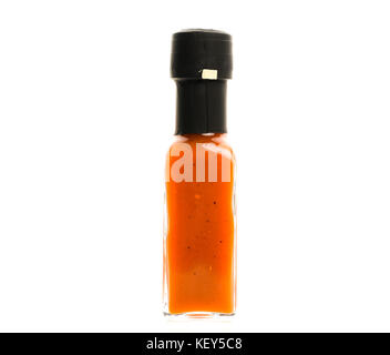 Hot Chili Sauce glass bottle on white background. Different color home made hot sauce in glass bottle.  100ml square bottle. Isolated on white backgro Stock Photo