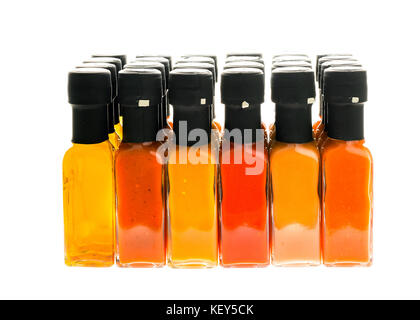 Set of Hot Chili Sauce glass bottles on white background. Different color home made hot sauce in glass bottles. Bottle of chilli sauce and olive oil m Stock Photo