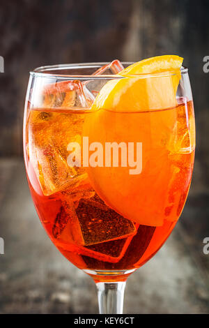 Aperol spritz cocktail in glass on wooden table Stock Photo