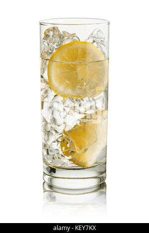 glass full of fresh water with lemon slices, on white background Stock Photo