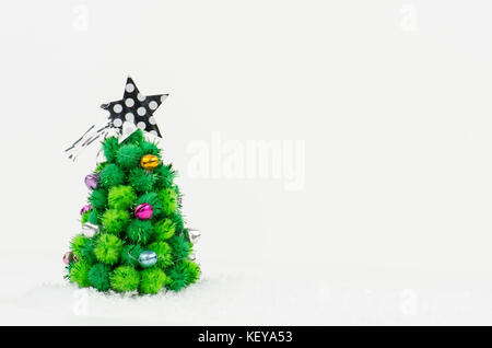 little Christmas tree isolated on white background Stock Photo