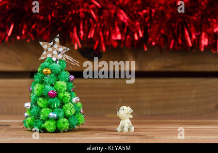 dog looking Christmas tree Stock Photo