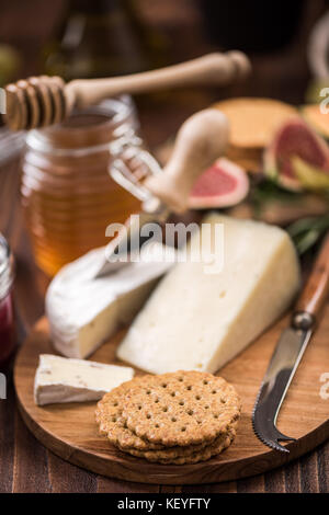 Cheese crackers on board, festive food. Stock Photo