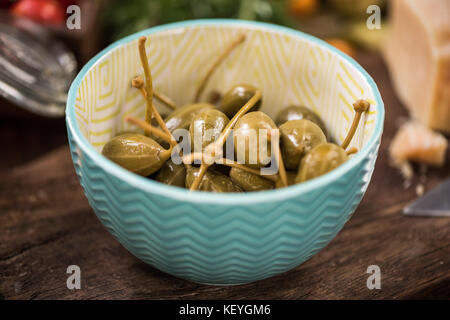Whole Capers in bowl,spanish tapa bar food Stock Photo Alamy