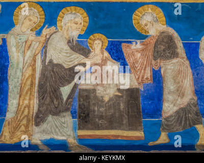 The presentation in the temple, Simeon holds baby Jesus and  Joseph come with two sacrificial doves in a cloth, a romanesque wall-painting in Bjaresjo Stock Photo