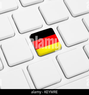 German language or Germany web concept. National flag button or key on white keyboard Stock Photo