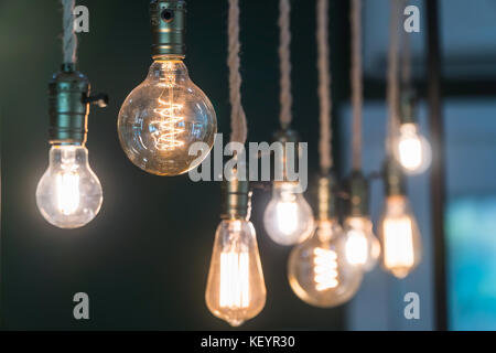 Vintage incandescent Edison type bulbs and window reflections. Stock Photo