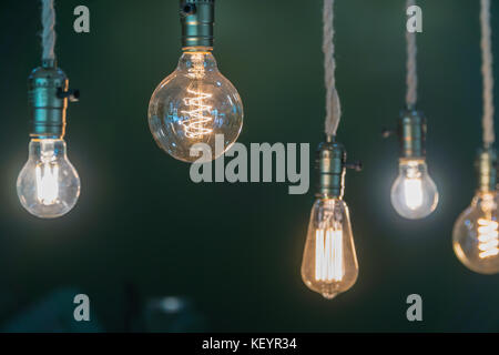 Vintage incandescent Edison type bulbs and window reflections. Stock Photo