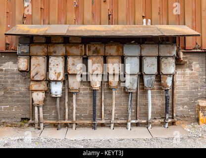 weathered rusty industrial detail including old corroded electric control cabinets Stock Photo