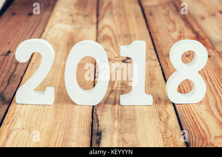 Wood number 2018 for New Year concept on wood table. Stock Photo