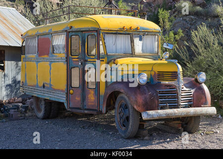 November 9, 2015 Nelson, Nevada, USA: old schooll bus at the abandoned mining ghost town a popular tourist attraction Stock Photo