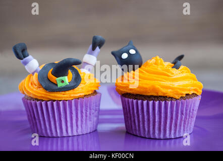 Witch and cat halloween cupcakes Stock Photo