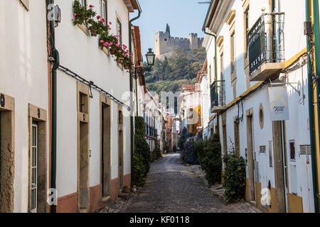 Narrow street in old town beneath the Convent of Christ, Tomar, Ribatejo Province, Portugal Stock Photo