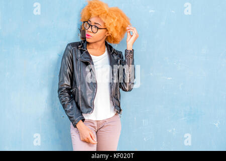 fashionable african american girl posing in 80s style clothes with