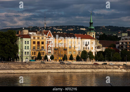City of Budapest in Hungary, row of picturesque riverside old city houses at Danube River waterfront. Stock Photo