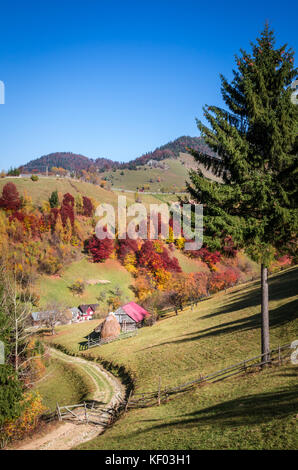 Autumn landscape. Colorful fall scene in a mountain village. Stock Photo