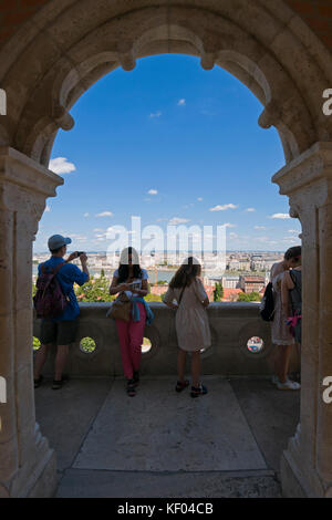 Vertical view of tourists admiring the view from the Fisherman's Bastion in Budapest. Stock Photo