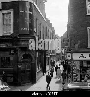 St Annes Court, Soho, City of Westminster, Greater London. View along St Anne's Court, Soho, showing signs for clubs and shops, with the corner of the Stock Photo