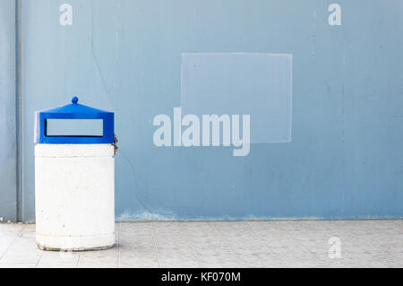 Outdoor dust bin isolated over urban background Stock Photo