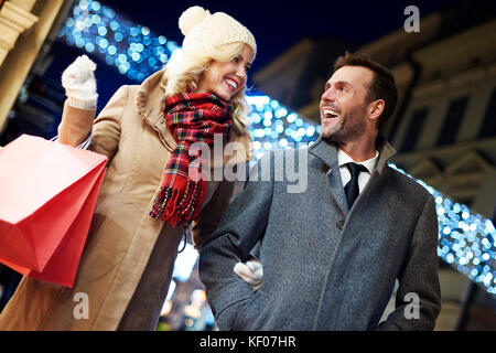Photography of cheerful couple with shopping bags Stock Photo