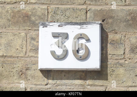 House number 36 sign on wall Stock Photo