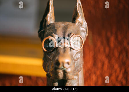 Vilnius, Lithuania - July 7, 2016: Close View Of Bronze Sculpture Of Dog In Glasses Near Optician Shop. Stock Photo