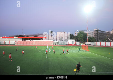 Football match in the evening at Victoria Stadium, Gibraltar, September 2017 Stock Photo