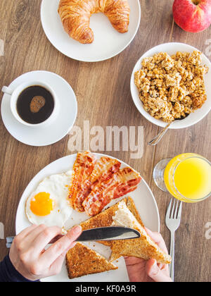 Morning toast with butter and a glass of fresh orange juice Stock Photo ...