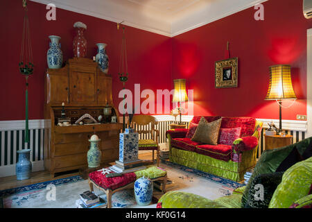 Elegant leaving room decorated in oriental exotic style and a secretaire in Biedermeier style Stock Photo
