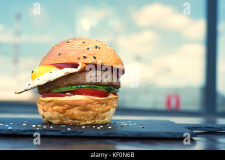 Delicious restaurant hamburger with fried egg Stock Photo