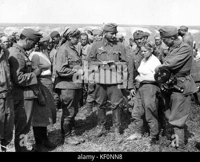 Movie camera, prisoner of war, war correspondent, Soviet soldier, woman soldier  29158 Stock Photo