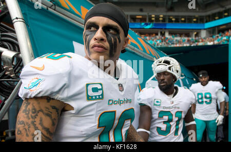 The Miami Dolphins enter the field before an NFL football game against ...