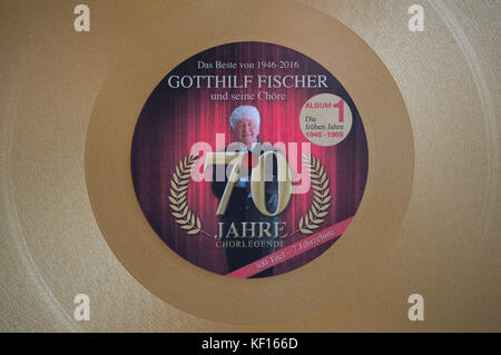 Stuttgart, Germany. 24th Oct, 2017. Choir director Gotthilf Fischer seen on the label of a golden record in Stuttgart, Germany, 24 October 2017. For 7 decades Gotthilf Fischer has been bringing choir music to Germany's turntables. His music label awarded the composer and director of the Fischer Choir with a golden record for '70 years of recording'. Credit: Marijan Murat/dpa/Alamy Live News Stock Photo